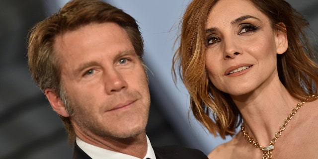 A close-up photo of Emanuele Filiberto with his wife on the red carpet