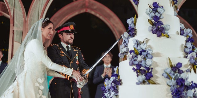 The prince and princess of Jordan cutting their cake