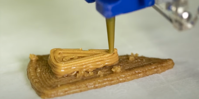 3-D printed graham cracker cheesecake is being printed