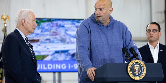 US President Joe Biden and Pennsylvania Governor Josh Shapiro look on as US Senator John Fetterman