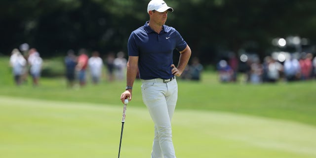 Rory McIlroy waits on course