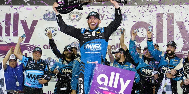 Ross Chastain hoists guitar