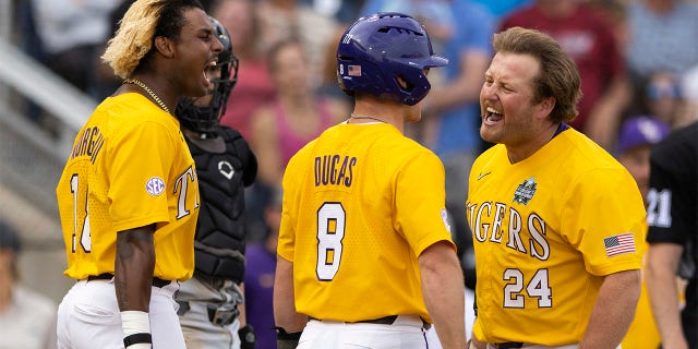 Cade Beloso celebrates with Tre Morgan and Gavin Dugas
