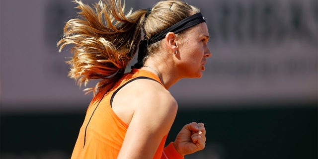 Marie Bouzkova celebrates winning a point