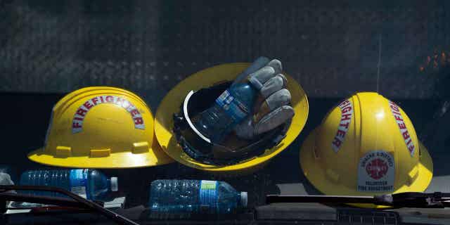 Firefighters helmets and water bottles