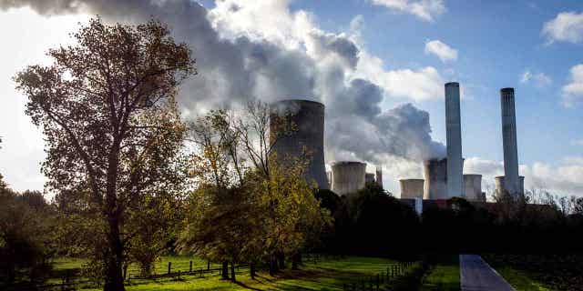 Steam rises from coal-fired power plant