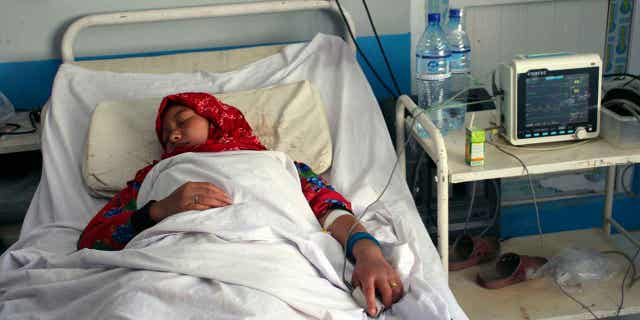 An Afghan schoolgirl receives treatment