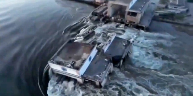 Floodwaters rush through buildings in southern Ukraine