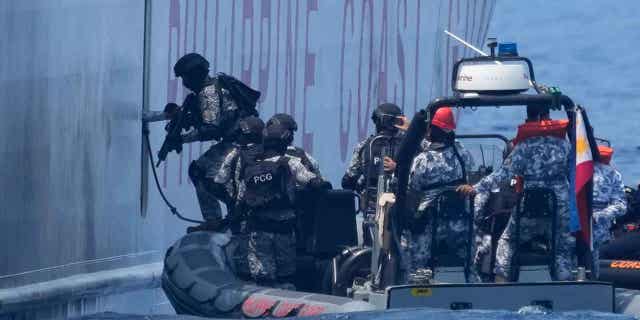 Armed Philippine Coast Guard personnel