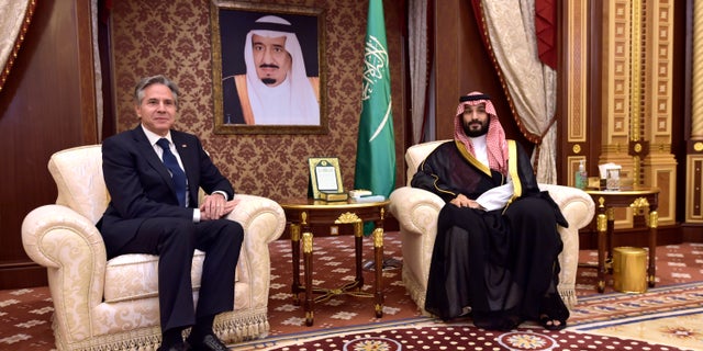 Saudi Arabia's Crown Prince Mohammed bin Salman sits with U.S. Secretary of State Antony Blinken