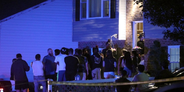 People in the front yard of a home