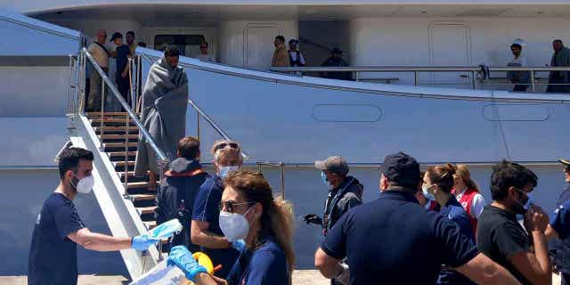 Survivors arrive by yacht 