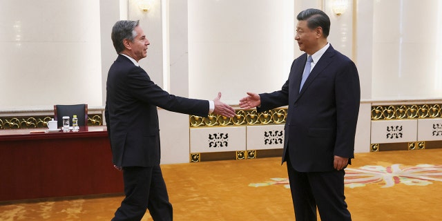 Blinken, Xi Jinping shaking hands