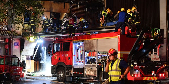 Chinese firefighters after restaurant explosion