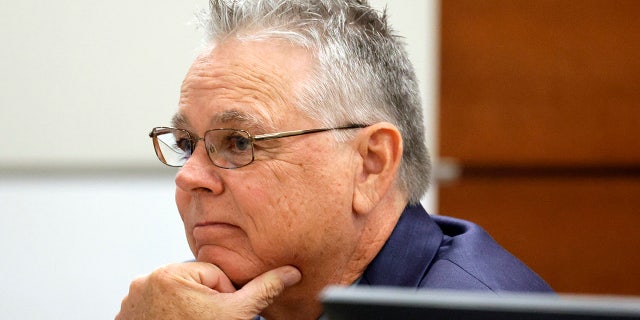 Scot Peterson sits at the defense table