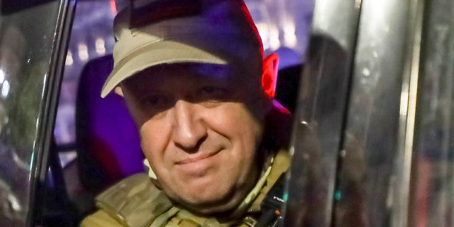 Prigozhin looks on from a street vehicle in Russia