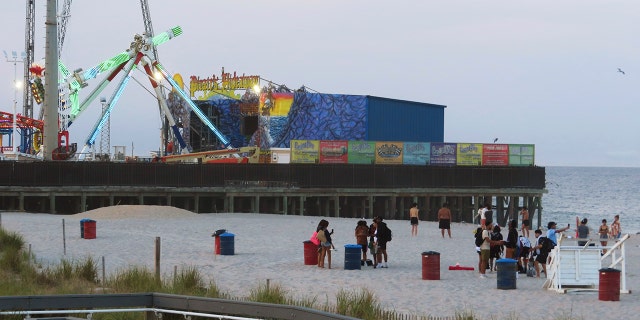 Young people gather peacefully on the beach in Seaside Heights, N.J