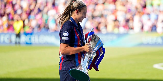 Alexia Putellas carries trophy
