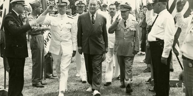 World War 2 hero inventor walks through a guard of honor