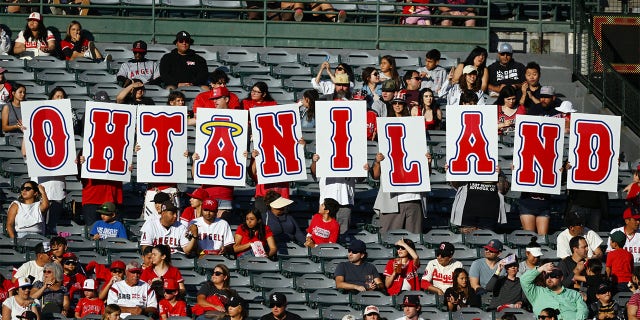 Angels fans hold a Shohei Ohtani sign