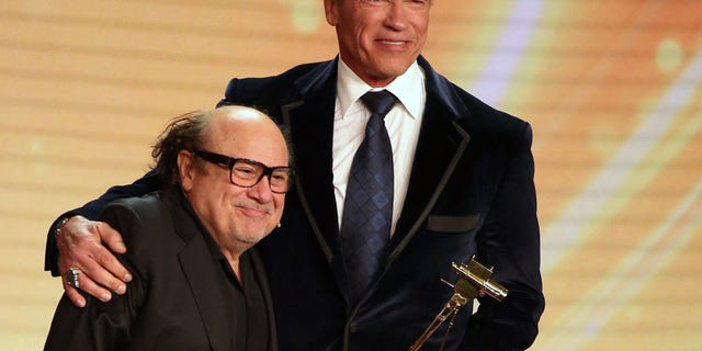 Arnold Schwarzenegger and Danny DeVito on stage together