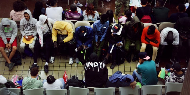 New York City asylum seekers wait to head to shelters