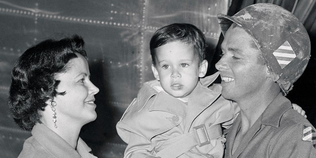 Audie Murphy Holding His Son