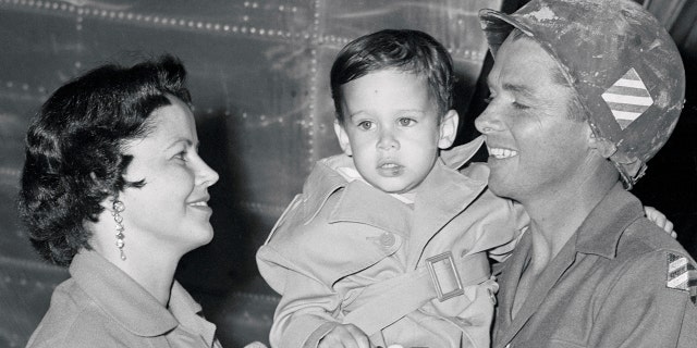 Audie Murphy Holding His Son