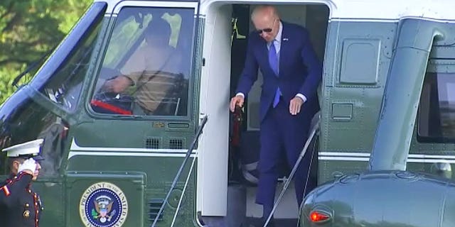 President Joe Biden hits head