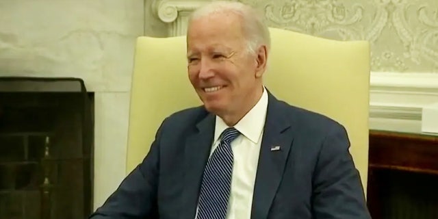 President Biden smirking