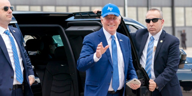 President Joe Biden waves