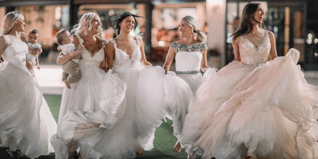 The 'Bonin Girls' have fun twirling in circles while wearing white gowns.