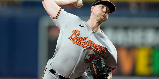 Kyle Bradish throws pitch