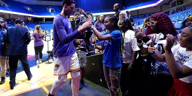 Brittney Griner talks with fans