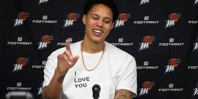 Brittney Griner smiles at a press conference