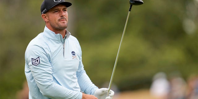 Bryson DeChambeau watches tee shot