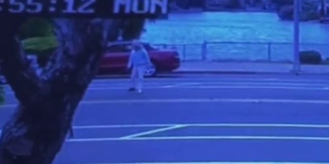 woman standing up in street