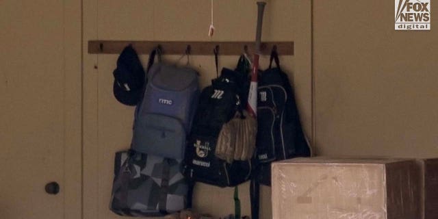 bag holding baseball equipment hangs outside the home of Cameron Robbins in Baton Rouge, Louisiana