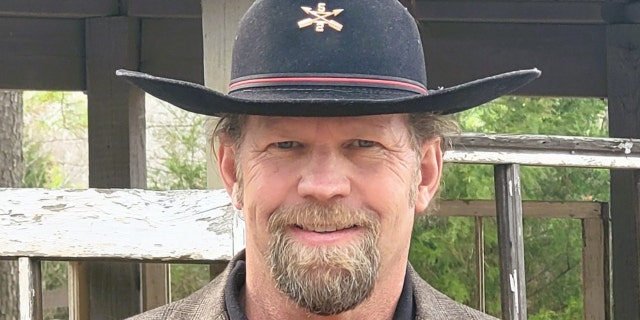 Michael R. Carmichael, Green Beret, wearing hat, civilian clothes