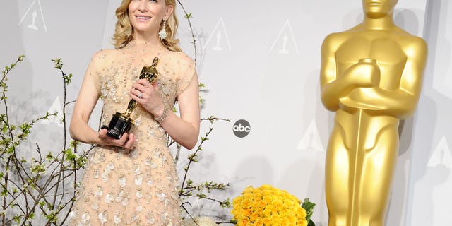Cate Blanchett holding her Oscar in 2014
