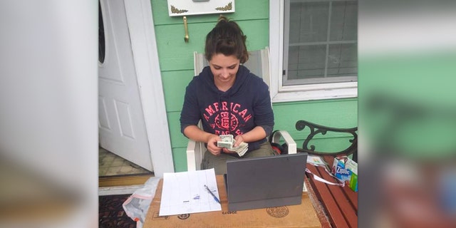 Charity Perry counts money