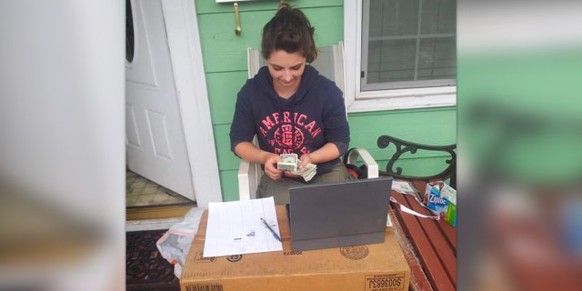 Charity Perry counts money