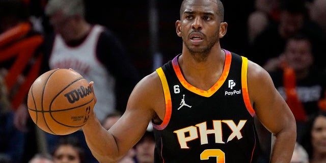 Chris Paul dribbles