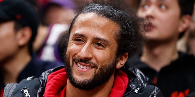 Colin Kaepernick watches the Raptors