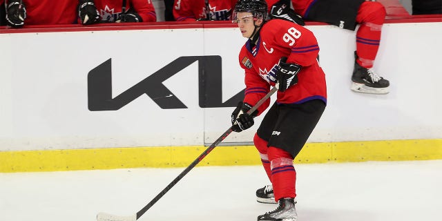 Connor Bedard moves with puck