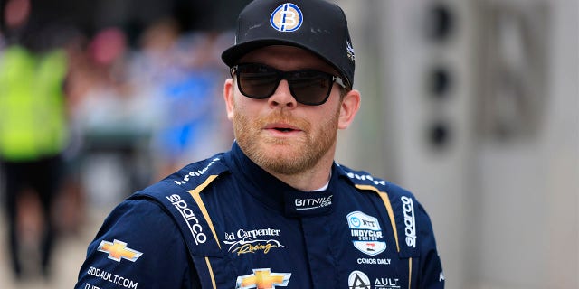 Conor Daly walking