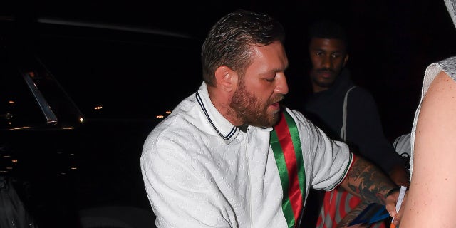 Conor McGregor signs autographs