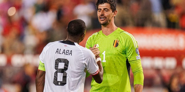 David Alaba and Thibaut Courtois embrace