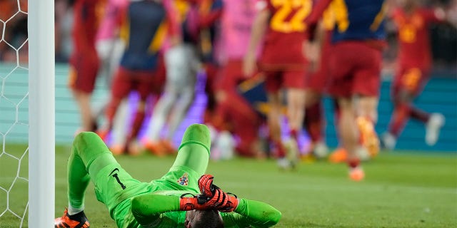 Dominik Livakovic lays on ground