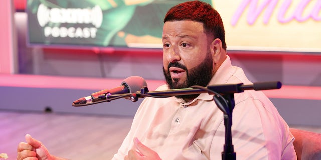 DJ Khaled in front of microphone